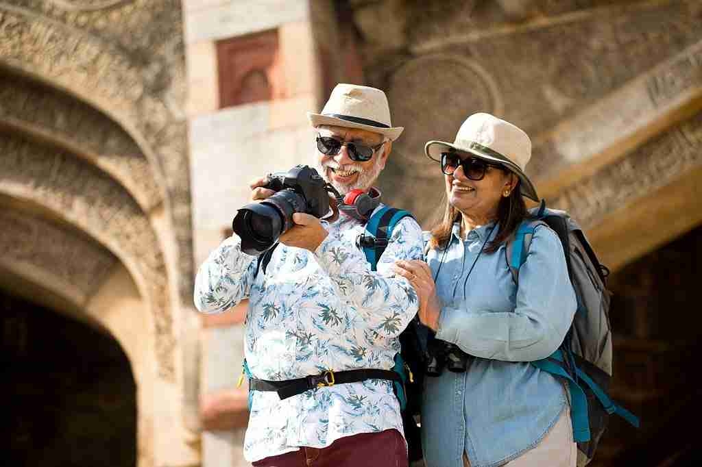 seniour traveling couple taking pictures
